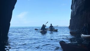 A Koru Kayaking adventure exploring the caves in kayaks off the coast of Cornwall, UK.